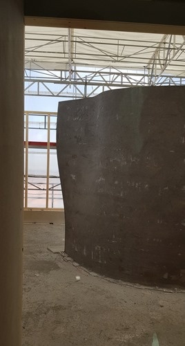 A load-bearing wall knitted from steel and printed in concrete by robots A load-bearing wall knitted from steel and printed in concrete by robots