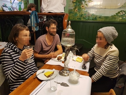A group drinking absinthe A group drinking absinthe