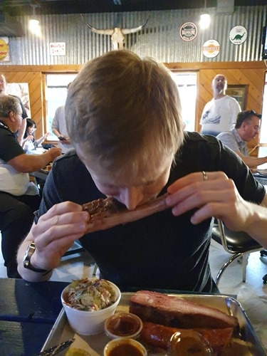 Tom tucking into BBQ Tom tucking into BBQ