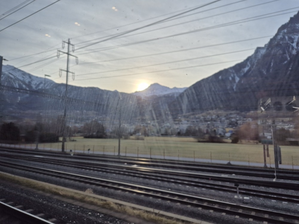 Sun poking over the Alps Sun poking over the Alps