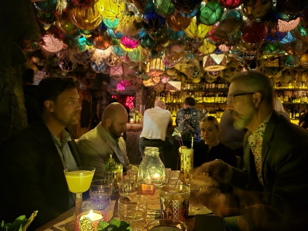 Deep discussions in a Tikki Bar Deep discussions in a Tikki Bar